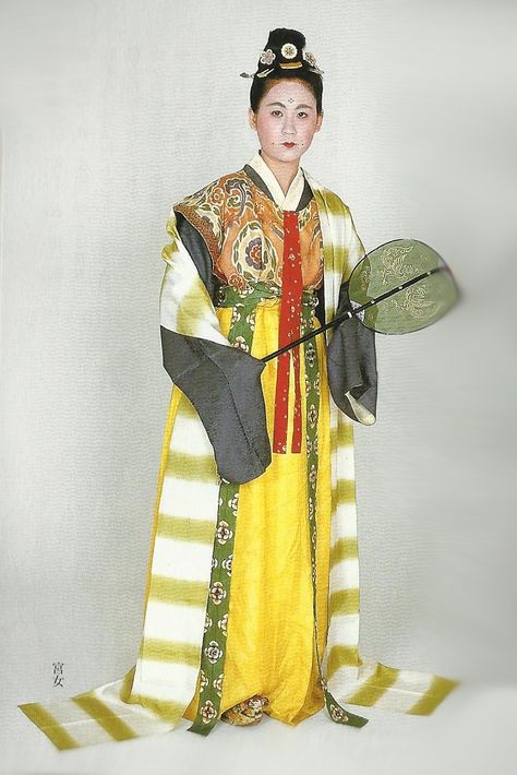 Court lady of the Nara Period (710-784) , Japan. Textiles during this period of Japan were often brocade ones heavily influenced by China (and in some cases the cloth itself was directly imported from that country)  . Scan from book “The History of Women’s Costume in Japan.”  Scanned by Lumikettu of Flickr.  Japanese costume many centuries ago…recreation accomplished in Kyoto during the 1930’s.. Nara Period Clothing, Traditional Clothing Around The World, Nara Period, Japanese Style Clothing, The Kimono Gallery, Kimono Gallery, Japanese Costume, Modern Costumes, Kimono Design