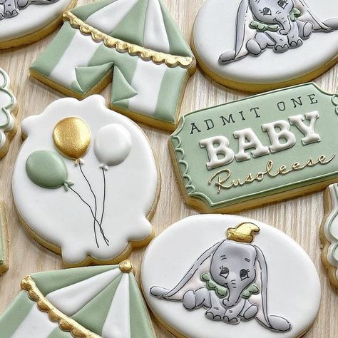 Karen Rogers Griffith on Instagram: "A “circus-lite” Dumbo baby shower in sage green, gold and white - no problem! 😅 I’ve known this sweet mom-to-be since she was a baby - so this one was extra special! Wishing you the very best Katie and Jon! Much love to you all! 😘 . #babyshowercookies #babyshower #circuscookies #dumbocookies #customcookies #sugarcookiemarketing #sugarcookies #decoratedsugarcookies #decoratedcookies #cookieartist" Dumbo Cookies Decorated, Dumbo Birthday Party Decorations, Dumbo Themed Baby Shower Ideas, Circus Theme Baby Shower Ideas, Dumbo Cookies, Dumbo Decorations, Dumbo Baby Shower Ideas, Dumbo Baby Shower Theme, Disney Baby Shower Themes