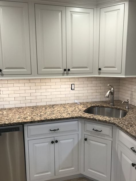 Grey And Tan Backsplash Kitchen, Busy Kitchen Countertop, Light Grey Kitchen Cabinets Dark Counter, Giallo Fiorito Granite Kitchens, Tan Kitchen Countertops, Kitchen With Brown Countertops, Tan Granite Countertops Kitchen Colors, Tan Countertops Kitchen, Brown Granite Countertops Kitchen