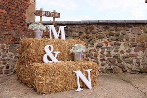 Straw Bale welcome set up for farm / barn wedding with large monogram letters, babies breath (gypsophila) and wooden directional wedding signage. Hay Bails For Wedding Seating, Straw Bales Wedding, Hay Bail Wedding, Hay Bale Seating Wedding, Hay Bale Wedding Decorations, Hunting Wedding Theme, Hay Wedding, Hay Bale Wedding, Farm Wedding Decorations