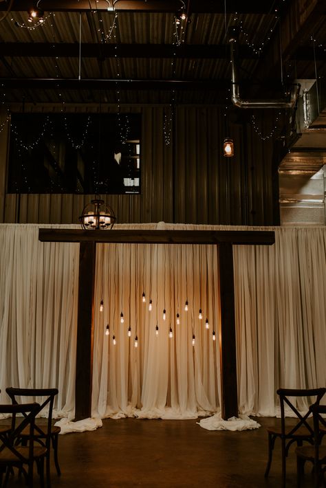 Edison Bulbs with soft white draping Edison Lighting Wedding, Ghost Quartet, Curtain Pull Backs, Wall Drapes, Wedding Draping, Draping Wedding, Wood Arch, Bistro Lights, Plain Curtains