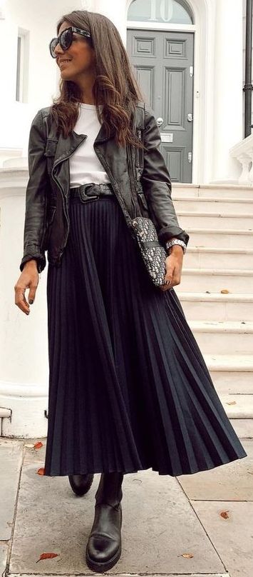 Winter Outfits With Pleated Skirts, Black Leather Jacket With Skirt, Black A Line Skirt Outfit Winter, Pleated Skirt Leather Jacket Outfit, Leather Pleated Midi Skirt Outfit, Long Black Pleated Skirt Outfit Winter, Black Pleated Skirt Fall Outfit, Black Accordion Skirt Outfit, Plisse Skirt Outfit Winter