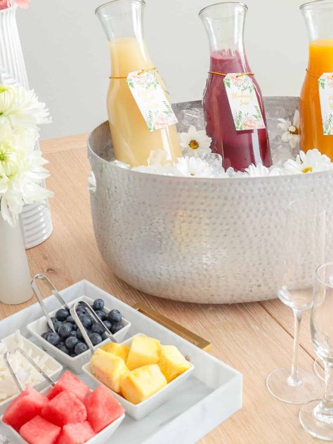 Here you can learn all of my tips and tricks for setting up a DIY Mimosa Bar right in your own home! It's simple, charming, and perfect for all of your spring and summer entertaining. From birthdays, bridal showers, brunch and more, guests will love helping themselves to your elegant set-up. Mimosa Bar Party Ideas, Coffee Bar Ideas Bridal Party, Mimosa Bar Set Up Bridal Shower Ideas, Mimosa Bar Baby Shower Ideas Boy, Mimosa Bar Bridal Shower Ideas, Mocktail Mimosa Bar, Virgin Mimosa Bar, Mimosa Charcuterie Board, Mom Mosa Bar