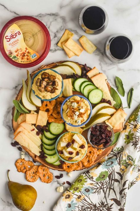 This Hummus Charcuterie Board is easy to throw together with three great spins on hummus. It's something your party guests will keep coming back to! Hummus Charcuterie Board, Friendsgiving Charcuterie Board, Friendsgiving Snacks, Hummus Bowl, Chicken Protein, Charcuterie Inspiration, Cucumber Recipes, Chicken Kebabs, Thanksgiving Appetizers