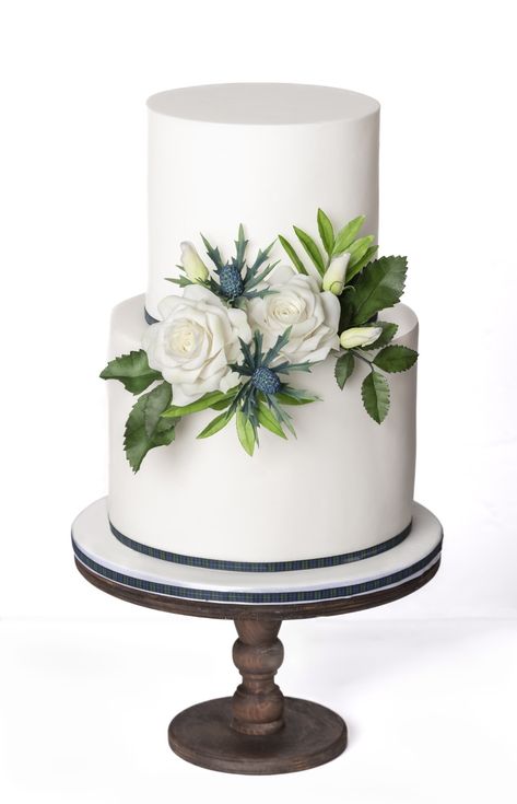 A classic Scottish-themed 2-tier white wedding cake, with handcrafted sugar roses, thistles, lisianthus buds and foliage, all complemented with a touch of tartan ribbon. White Fondant, Tartan Ribbon, Scottish Wedding, Bespoke Wedding, Wedding Cake, Wedding Cakes, Bespoke, Roses, Cake