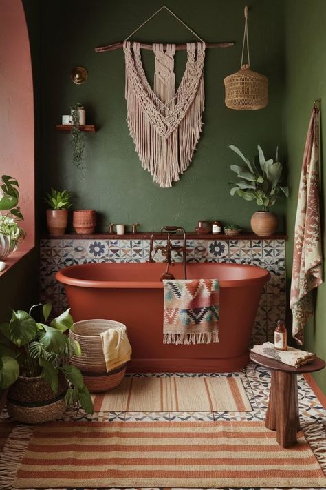 Bohemian bathroom featuring deep green walls, terracotta accents, patterned tiles, and a freestanding bathtub. Cozy Eclectic Bathroom, Green Color Scheme Bathroom, Dark Boho Bathroom Ideas, Terracotta And Green Bathroom, Bohemian Bathroom Decor Ideas, Green And Terracotta Bathroom, Small Cozy Bathroom, Deep Green Bathroom, Boho Bathroom Green