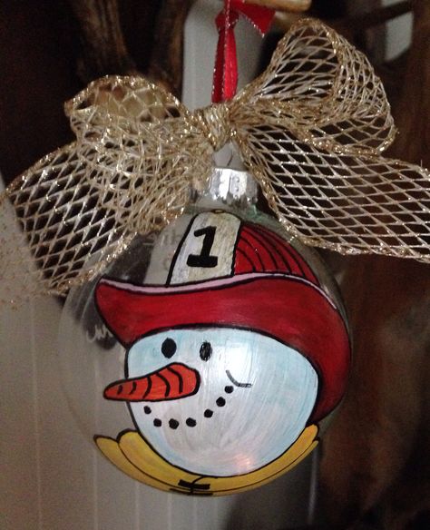 I freehand painted a glass ornament with Fire Fighter Snowman. Fireman Ornaments Diy, Fire Department Christmas, Firefighter Crafts, Firefighter Christmas, Firefighter Decor, Bulb Ornaments, Fire Wife, Christmas Rock, Painted Christmas Ornaments