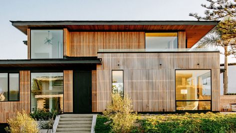 Overhanging roofs shade outdoor areas of cedar-clad Seaside Reef House Australian Beach House, Rectangular Swimming Pools, External Cladding, Seaside House, Australian Beach, Concrete Steps, Australian Architecture, Beautiful Dream, Modern Coastal