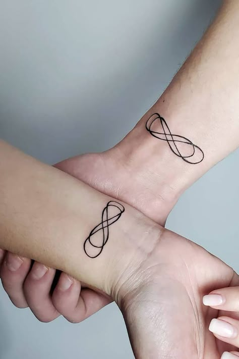 29 Superb Infinity Tattoo Designs Small Infinity Tattoos On Wrist, Infinity X Infinity Tattoo, Creative Infinity Tattoo, Infinity 8 Tattoo, Cross With Infinity Sign Tattoo, Inifity Tattoo Design, Best Friend Infinity Tattoos, Infinity Tattoo Designs For Couples, Infitiny Tattoo