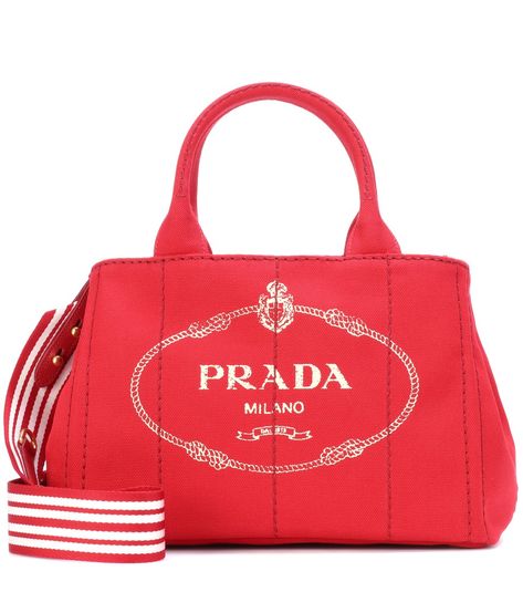 Prada - Printed canvas tote - Lend your looks instant recognition with Prada's printed canvas tote. Carry yours in-hand or swing it over your shoulder by the optional shoulder strap. seen @ www.mytheresa.com Chanel Tote Bag, Red Chanel, Chanel Tote, Handbag Outfit, Miuccia Prada, Coach Horse And Carriage Tote, Prada Handbags, Chanel Deauville Tote Bag, Fashion Labels