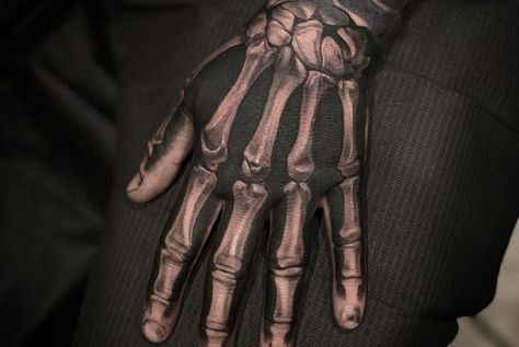 100 Fantastic Skeleton Hand Tattoos (Cool & Unique) Bones On Hand Tattoo, Skeleton Tattoo Hand Men, Skeleton Hand Tattoos For Guys, Hand Bones Tattoo, Skeleton Finger Tattoo, Skeleton Hand Tattoo Design, Dark Hand Tattoos, Angel Hand Tattoo, Skeleton Fingers