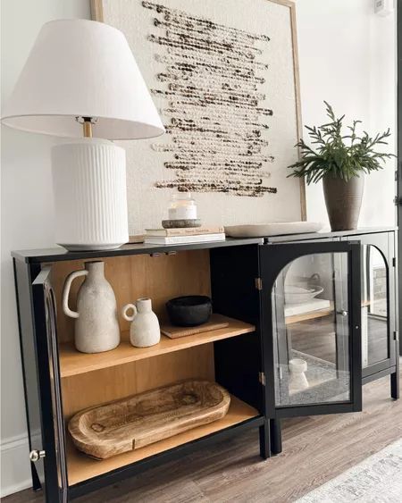 My entryway cabinets are back in stock, and they look stunning in my space! If you're into styling entryways, black cabinets, or modern home decor, check out these Nathan James cabinets and see how I've styled them. You’ll find some great entryway decor and shelf styling ideas! Entryway Cabinet Ideas, Entryway Cabinets, Shelf Styling Ideas, Nathan James, Entryway Style, Entryway Cabinet, My Space, Black Cabinets, Shelf Styling