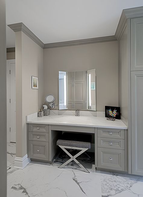 Custom built-in make-up vanity in master bathroom has stained gray cabinetry and quartz countertop. Designed and Built by Benvenuti and Stein for Winnetka home. #makeupvanity #graybathroom #customvanity #custombathroom Get Ready Vanity In Bathroom, Bathrooms With Vanity Area, Makeup Vanity With Linen Cabinet, Built In Makeup Table, Build In Vanity Bedroom, Bathroom Towel Storage Cabinets, Makeup Table In Bathroom, Custom Bathroom Makeup Vanity, Built In Make Up Table