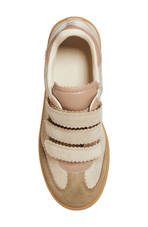 Smart pinking traces the contours of an easy-going sneaker styled with a low-top profile and dot perforations racing up the sides. Adjustable hook-and-loop straps Leather upper and lining/rubber sole Made in Portugal Women's Designer Shoes Women Shoes 2024, Neutral Sneakers Women, Cute Sneakers For Women, Designer Wishlist, Cream Sneakers, Cool Sneakers, Woman Sneakers, Skor Sneakers, Cool Girl Style