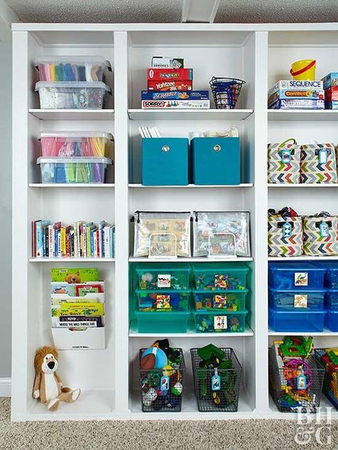 Organizing a wall of bookshelves in this multifunctional family room ensures kids can easily access toys, books, and more. Cleanup is a snap too! #storage #shelves #organize Wall Of Bookshelves, Tidy Tips, Playroom Storage Ideas, Room Bookshelf, Toy Storage Solutions, Decorating Bookshelves, Ikea Billy Bookcase, Library Wall, Toy Storage Organization