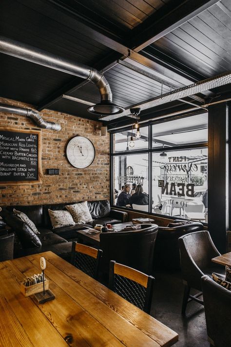 Coffeeberry: A Coffee Shop Makeover Leather Couch Coffee Shop, Coffee Shop Style Kitchen, Masculine Coffee Shop, Western Coffee Shop Aesthetic, Black Coffee Shop Aesthetic, Coffee Shop Seating Area, Dark Moody Coffee Shop, Coffee Shop Interior Design Cozy, Dark Coffee Shop