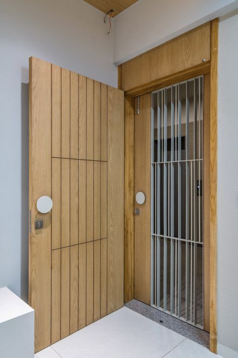 Dominance of Earthy Palette in This Minimally Design Residence | Archaic Design Studio - The Architects Diary Jaali Door, Puja Door, Window Grill Ideas, Safety Door Design, Jali Door, Window Grills, Grill Designs, Jali Design, Entry Door Designs