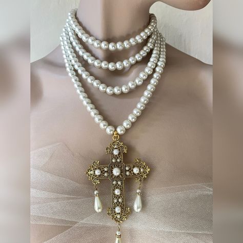 Multi strand pearl necklace with Baroque style cross. Make a statement wearing this unique piece. I offer the following varioations for this necklace 4 strands of Preciosa glass pearls 3 stands of Preciosa glass peals 3 strands of Preciosa glass pearls with silver crystal rondelle spacers 3 strands of Preciosa glass pearls with gold crystal rondelle spacers I offer this cross in gold or silver colours. The cross, has cabochon pearls and clear crystal glass chatons and 3 drop pearls hanging from Cross Necklace Layered, Cross Gold Necklace, Princess Photoshoot, Baroque Jewelry, Multi Strand Pearl Necklace, Cross Necklace Women, Cross Gold, Necklace Christian, Layered Pearl Necklace