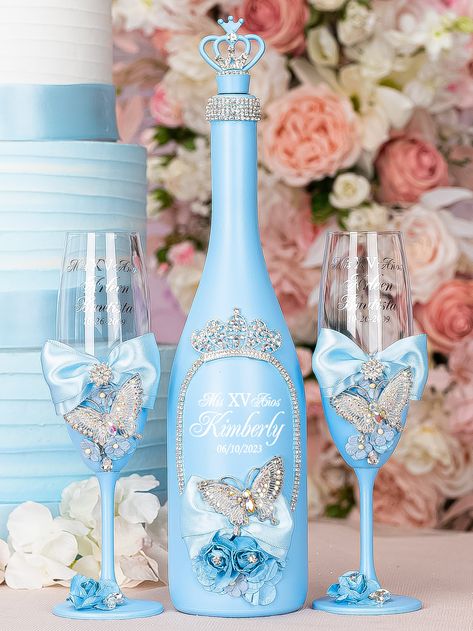 Light blue with butterflies quinceanera bottle with 2 glasses Quinceañera Decorations Ideas Blue, Cinderella Decorations For Quince, Light Blue Quince Ideas, Blue Butterfly Themed Birthday Party, Center Piece Quinceañera, Light Blue Centerpieces, Cinderella Quinceanera Themes Decoration, Quince Cups, Cinderella Themed Quinceanera