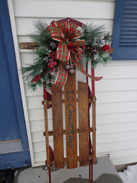 Our childhood sled that my sister had the foresight to save.  She was gracious enough to let me repurpose it for a very special Christmas decoration. Christmas Sled Decoration, Sled Decor, Wooden Sled, Christmas Sled, Christmas Porch Decor, Christmas Sleigh, Christmas Porch, Primitive Christmas, Vintage Christmas Decorations