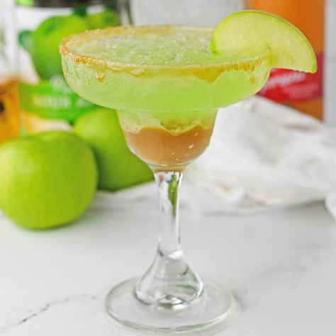 Caramel Apple Margarita Sour Apple Margarita, Caramel Apple Margarita, Caramel Apple Drinks Alcohol, Apple Drinks Alcohol, Apple Pucker Drinks, Baked Apple Cheesecake, Apple Margarita, Flavored Tequila, Sour Apple Pucker