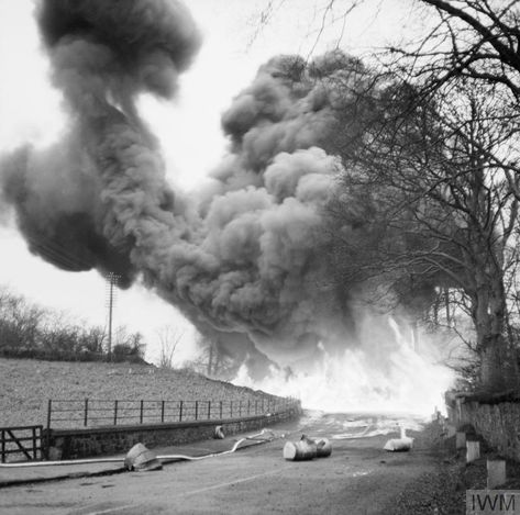 A flame barrage demonstration staged by the Petroleum Warfare Department at Mid Calder in Scotland, 28 November 1940. Barrels of petrol were projected using a 'hedge hopper' device and ignited electrically, and were intended for use against enemy tanks and vehicles. British Petroleum, Midway Atoll, Battle Of Midway, Midway Islands, Normandy Beach, Ww2 History, Pearl Harbor Attack, Air Raid, 28 November