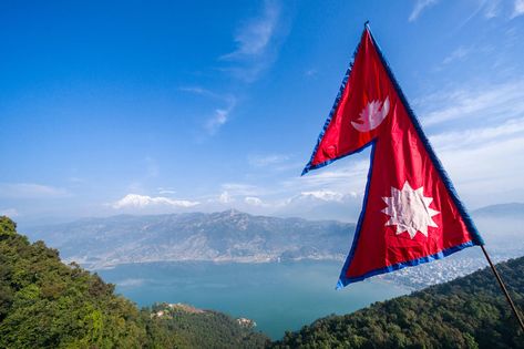 Nepal was unified during the reign of the Gorkha king Prithivi Narayan Shah in the mid-1700s, and many accounts date the creation of the double-pennant, sun-and-moon flag to around this time, or to the early 1800s. | image The Nepali national pennant Nepali Flag Wallpaper, Flag Nepal, Nepal Flag Wallpaper, Nepal Flag Image, Nepali Flag, Nepal Flag, Cricket Tips, Weather Report, National Flag