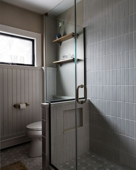 this bathroom strikes the perfect balance between classic and contemporary design. from the sleek brass fixtures to the rich wood tones, every element brings warmth and sophistication. we love how the clean, minimalist lines of the floating vanity and geometric mirror create a crisp, modern feel while the beadboard wainscoting adds a timeless charm. the touch of greenery not only softens the space but also enhances the wellness vibe we’re always striving for.⁠ ⁠ at lawless, we specialize in c... Unique Tile Patterns, Boston Interior Design, British Aesthetic, Beadboard Wainscoting, Boston Interiors, New House Bathroom, Geometric Mirror, Zellige Tile, Brass Fixtures