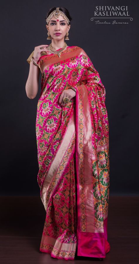 A classic example of Banarasi ingenuity! This absolutely stunning pink Banarasi Patola Silk Saree has been painstakingly made using the minakari technique. For purchases, please WhatsApp on +91-9828711-116 or email us on shivangikasliwal@gmail.com We ship worldwide. Instagram: shivangikasliwaalbanaras #shivangikasliwaalbanaras #banarasi #silk #saree #sari #silksaree #indiantextiles #weave #handwoven #indianwedding #indianbride #desibride #jaipurshopping Patola Silk Saree, Desi Bride, Summer Bride, Fancy Blouse, Banarasi Silk Saree, Wedding Sarees, Unique Blouse, Indian Textiles, Pattu Saree