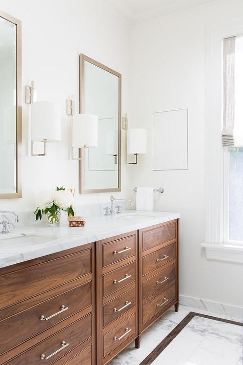 You'll feel right at home in this lovely brown bathroom fitted with a stained oak dual washstand finished with nickel pulls and a white marble countertop holding his and her sinks beneath polished nickel faucets. White Double Vanity Bathroom, White Double Vanity, Rustic Bathroom Designs, Bad Inspiration, Brown Bathroom, White Marble Countertops, Double Vanity Bathroom, Marble Bathroom, Bathroom Remodel Master