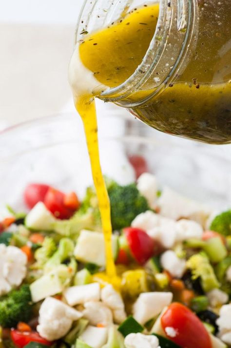 dressing poured over a bowl of vegetable salad. Marinated Salad Recipes, Marinated Vegetable Salad, Marinated Veggies, Grilled Cheese Croutons, Roasted Cauliflower Steaks, Broccoli Cauliflower Salad, Crunch Salad, Homemade Italian Dressing, Marinated Vegetables