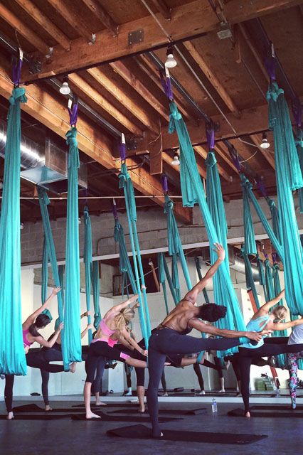 AIR - workout, chicago A unique combination of resistance and suspension — achieved by hanging from the ceiling in gorgeous silk hammocks — lengthens and tones muscles while keeping you more than entertained. The classes, which blend the best of barre, yoga, and Pilates in one, tap muscles you didn’t even know you had. AIR currently has a River North and Lincoln Park location, with a Streeterville ... Sala Yoga, Yoga Studio Design, Aerial Fitness, Yoga Kurse, Unique Workouts, Yoga And Pilates, One Tap, Cardio Training, Aerial Yoga