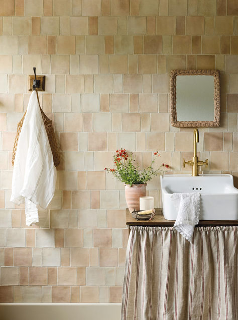 Pale clay or terracotta tones are perfect for creating interior schemes with a neutral but eye-catching feel. This bathroom used our Barnfield glazed wall tiles in both the rectangle and square for a modular look. The Sand option used here has a lovely wide variation of warm tones, and could be equally effective as a kitchen splashback. The basin is our Spitalfields small basin, with Bournbrook basin mono tap. Terracotta Bathroom Walls, Cream Tile Bathroom, Bathroom Tiles Combination, Wall Paint Inspiration, Peach Bathroom, Cream Tile, Kitchen Splashback Tiles, Tile Splashback, Glazed Walls