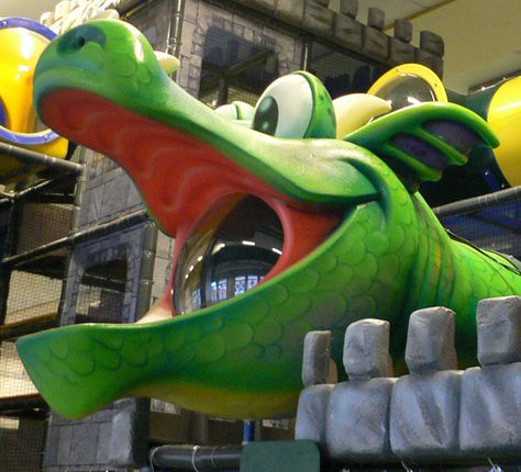 Custom indoor playground with a dragon head. This is a castle design by #Iplayco. ~~ #custom #theming #castle #dragon  #playground #play #structure Dragon Playground, Childrens Museum Ideas, Play Grounds, Commercial Indoor Playground, Museum Ideas, Foam Props, Play Place, Interactive Events, Entertainment Center Design