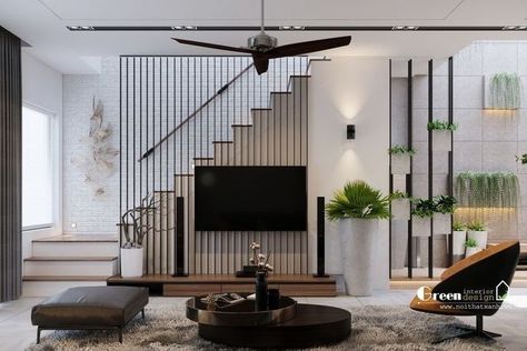 Tv By Stairs, Staircase Tv Wall, Living Room Staircase Design, Tv Unit Under Staircase Living Rooms, Tv Wall Stairs, Black And White Interior House, Under Stairs Living Room, Tv Under Stairs Living Room, Under Stairs Design