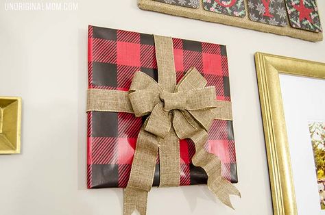 How to decorate a gallery wall for Christmas - great tips! I love the frames wrapped to look like gifts! Picture Wrapped As A Present On Wall, Wrapped Picture Frames Christmas, Wrap Pictures On Wall Christmas, Pictures Wrapped As Presents On Wall, Christmas Wrapped Pictures On Wall, Frame Wrapping Ideas, Wrapping Pictures On Wall Christmas, Framed Wrapping Paper, Dit Gifts