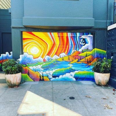 Not only the interior of the garage is thought, now you can decorate the outside of the garage with a colored door design. For example, you can apply colorful mural art to the garage door. This will also be a show of your work that can be seen by everyone. Colorful Mural Garage Door from @valerieanneturck12 #garagedecoration #garageupdateideas Garage Door Art Painted, Garage Door Murals Art, Garage Door Art, Artistic Garden, Garage Mural, Garage Door Mural, Colored Door, Garage Door Paint, Garage Update