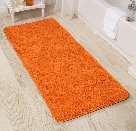 Use this plush oversized mat to add a touch of spa-like luxury to your home. The 24-inch-wide by 58-inch-long size of this bath rug is ideal for bathrooms with double vanities, claw foot tubs, or large walk-in showers. Unlike many other chenille bath mats, this bath runner has a memory foam core that provides plenty of cushioned comfort as you step out of your tub or shower. The bath mat runner will put you at ease while you get ready to start your day. Orange Bath, Bathroom Runner, Bath Runner, Bathroom Runner Rug, Orange Bathroom, Orange Bathrooms, Bathroom Rugs Bath Mats, Cotton Bath Rug, Bath Rugs Sets