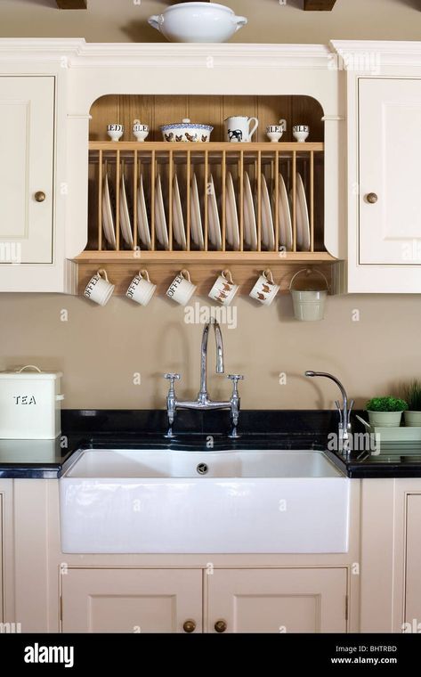 Download this stock image: Fitted plate rack in fitted cream cupboard above white butler's sink in country kitchen - BHTRBD from Alamy's library of millions of high resolution stock photos, illustrations and vectors. Apron Farmhouse Sink, Best Farmhouse Sinks, Above Kitchen Sink, Outdoor Kitchen Sink, White Farmhouse Sink, Above Sink, Fireclay Farmhouse Sink, Vintage Tub, Apron Sink Kitchen