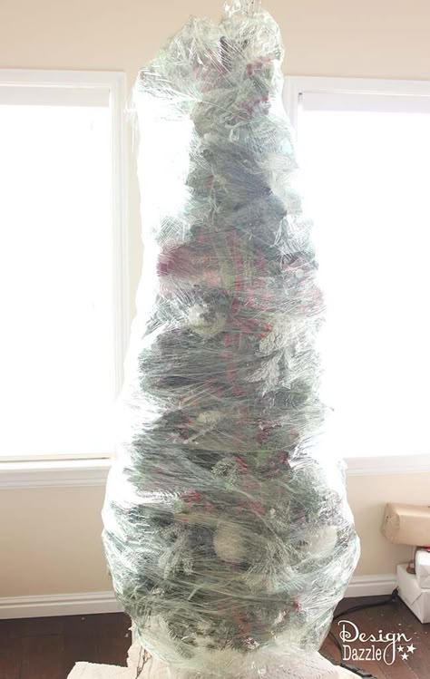 This year, wrap up your Christmas tree for easy storage! The BEST Christmas decorating and time-saving tip ever!! Wrap up your artificial DECORATED Christmas tree and store for next year. No putting away your ornaments and taking down the tree. LOVE this idea! Design Dazzle Storing Christmas Tree, Diy Christmas Tree Storage, Christmas Tree Storage Ideas, Christmas Storage Ideas, Store Christmas Tree, Organized Christmas Decorations, Christmas Decoration Storage, Christmas Tree Storage Bag, Storing Christmas Decorations