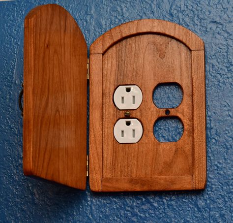 This is an outlet cover door. It is made of Stained cherry wood and is ready to cover your outlets. The door opens and closes. This cover will fit most outlets and replaces the original cover plate. The cover is roughly 8 inches by 5 1/4 inches. The outlet itself is not included just the door. This is the door you will receive. Wood Outlet Covers, Diy Light Switch Cover Ideas, Floor Outlet Cover, Hidden Outlet, Cover Door, Fairy Door, Outlet Cover, Light Switch Plate Cover, Light Switch Cover