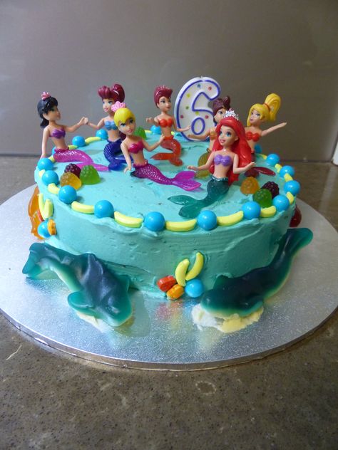 Ariel, Little Mermaid birthday cake. As requested by the birthday girl, Ariel and her sisters at the top, fish in the middle and sharks at the bottom. So simple yet so effective. Simple Mermaid Birthday Cake Diy, Ariel Birthday Cake Simple, Simple Mermaid Birthday Cake, Ariel And Her Sisters, Birthday Cake Simple, Birthday Greetings For Women, Little Mermaid Birthday Cake, Mermaid Birthday Cake, Ariel Birthday Party