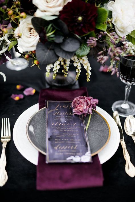 Create a romantically spooky feel for your Halloween-inspired wedding with a black and deep purple color palette. Pops of gold on the menu lettering and silverware provide a sophisticated metallic accent. | Moody Jewel-Toned Halloween Wedding Inspiration Shoot | #equalitymindedweddings #lgbtweddingmagazine #loveinc #halloweenwedding #halloween #blackpurplewedding #halloweenphotoshoot Colourful Christmas, Purple Color Palettes, Dark Wedding, Moody Wedding, Marriage Ceremony, Gothic Wedding, Halloween Wedding, Deco Table, Wedding Planners