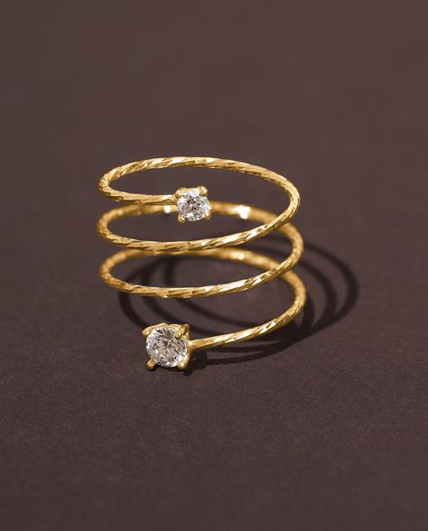 Introducing our exquisite Gold Plated 14K Spiral Ring with Cubic Zirconia Accents, a stunning piece of jewelry crafted for the modern woman. This delicate pinky ring is designed to add a touch of elegance and glamour to any outfit, making it the perfect accessory for both everyday wear and special occasions. The intricately designed spiral band exudes beauty and sophistication, while the sparkling cubic zirconia accents capture the light with every movement, creating an enchanting shimmer. This Spiral Finger Rings Gold, Finger Rings Designs Gold, Spiral Rings Gold, Engment Ring, Modern Gold Jewelry Unique Designs, Gold Finger Rings Unique, Full Finger Ring Gold, Gold Ring Design For Women, Gold Wire Jewelry