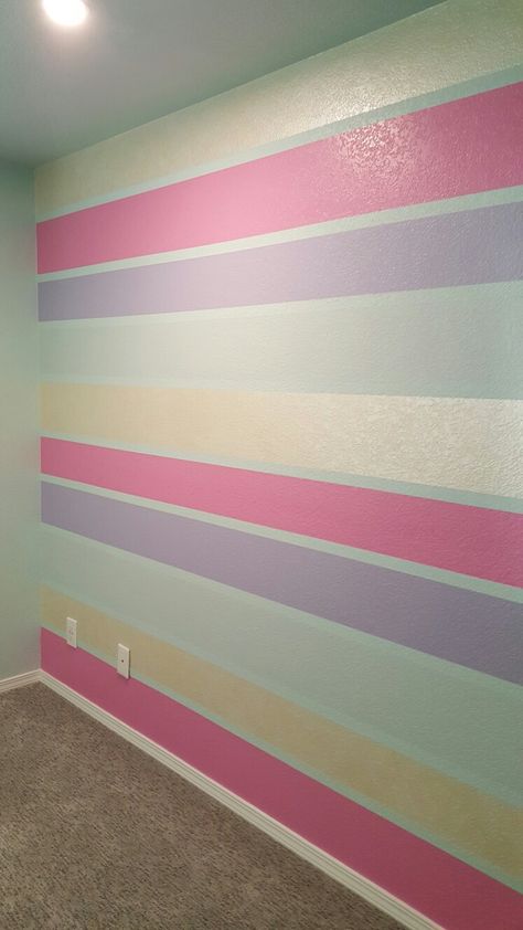 Striped wall. Pink, purple, blue and gold. Pink Purple And Blue Wall Paint, Pink And Purple Striped Walls, Pink Purple Blue Bedroom Girl Rooms, Pink And Purple Wall Paint Ideas, Stripped Wall Paint, Disney Cottage, Purple Striped Walls, Girl Bedroom Designs Pink, Blue Room Paint