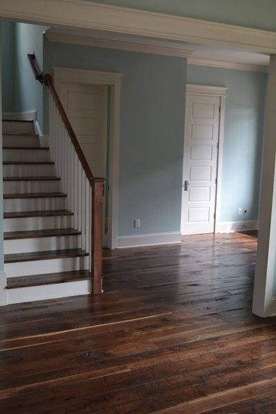 i love the brown floors and pale blue walls Slate Blue Walls, Beams Fireplace, Dark Brown Floor, Basement Colors, Pale Blue Walls, Staircase Art, Bathroom Downstairs, Dark Wooden Floor, Reclaimed Wood Flooring