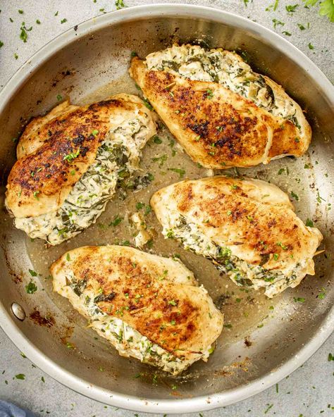 This Spinach and Artichoke Stuffed Chicken! Juicy chicken breasts filled with a creamy spinach-artichoke mix—it's delicious and easier than you think! 🥬🧀 #SpinachArtichokeChicken #StuffedChicken #EasyDinner Chicken Spinach Recipes, Spinach Artichoke Chicken, Artichoke Chicken, Favorite Recipes Chicken, Creamy Spinach, Winner Winner Chicken Dinner, Spinach Artichoke, Frozen Spinach, Spinach Recipes