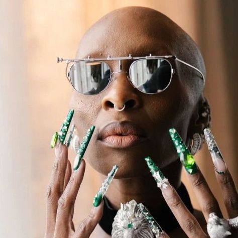 Nailcon™️ on Instagram: "@Cynthiaerivo for the @wickedmovie premier in Sydney, Australia 💚 Nails designed by @rosedoesmynails using @opi @opi_professionals⁠ ⁠ Nail Details:⁠ -The green base is Midnight Snacc mixed with Ozitively Elphaba for shimmer ✨⁠ -Some of Ozitively Elphaba is mixed with Top Coat for a jelly effect ⁠ -The layered colors are topped with embellishments and dark green encapsulated lace for an overall layered glam look.⁠ ⁠ #cynthiaerivo #wickedmovie" Wicked Nail Designs, Elphaba Nails, Australia Nails, Nail Details, Wicked Nails, Cynthia Erivo, Glam Look, Glam Looks, Professional Nails