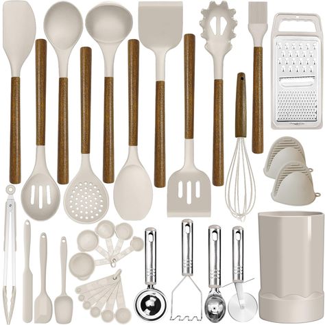 PRICES MAY VARY. 34 COOKING UTENSILS - Utensil Set includes everything you need to cook that perfect dish,includes Slotted Spatula ,Slotted Spoon,Flexible Spatula,Slotted Turner, Solid Turner, Pasta Server,Solid Spoon, Kitchen Tongs, Draining Spoon, Whisk ,Deep Soup Ladle,Spatulas,Brush,Peeler,Pizza Cutter,Potato,Pusher,Ice-cream spoon,Can opener,Grater,measuring cups and spoons set,Cheese knife,Spatula,Holder PROTECT YOUR EXPENSIVE PANS: The non-scratch silicone heads pair great with your expen Kitchen Tools And Equipment, Spatula Holder, Kitchen Pans, Cream Kitchen, Silicone Kitchen Utensils, Kitchen Spoon, Kitchen Cooking Utensils, Tongs Kitchen, Cooking Utensils Set