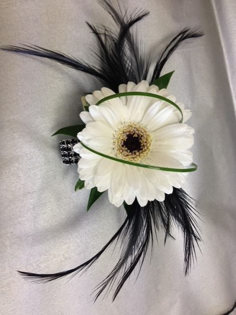 Germini wrist corsage with black feathers on a black diamante bracelet. Corsage With Feathers Wrist, Corsages For Black Dress, Corsage Formal, Black Wrist Corsage, Grad Flowers, Hoco Flowers, Diy Wrist Corsage, Prom Flowers Bouquet, Prom Flowers Corsage